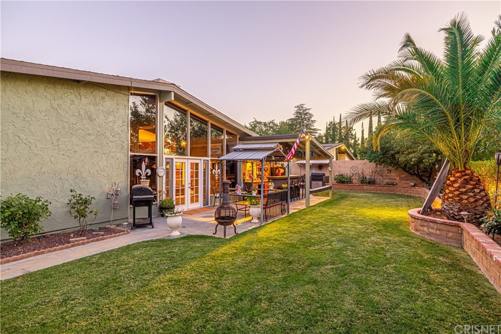 2701 West Ave J4 Lancaster, CA 93536 - Photo 42 of 46 a view of a house with backyard porch and sitting area