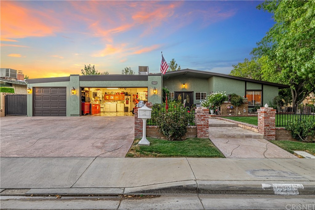 2701 West Ave J4 Lancaster, CA 93536 - Photo 44 of 46 front view of a house with a yard and potted plants