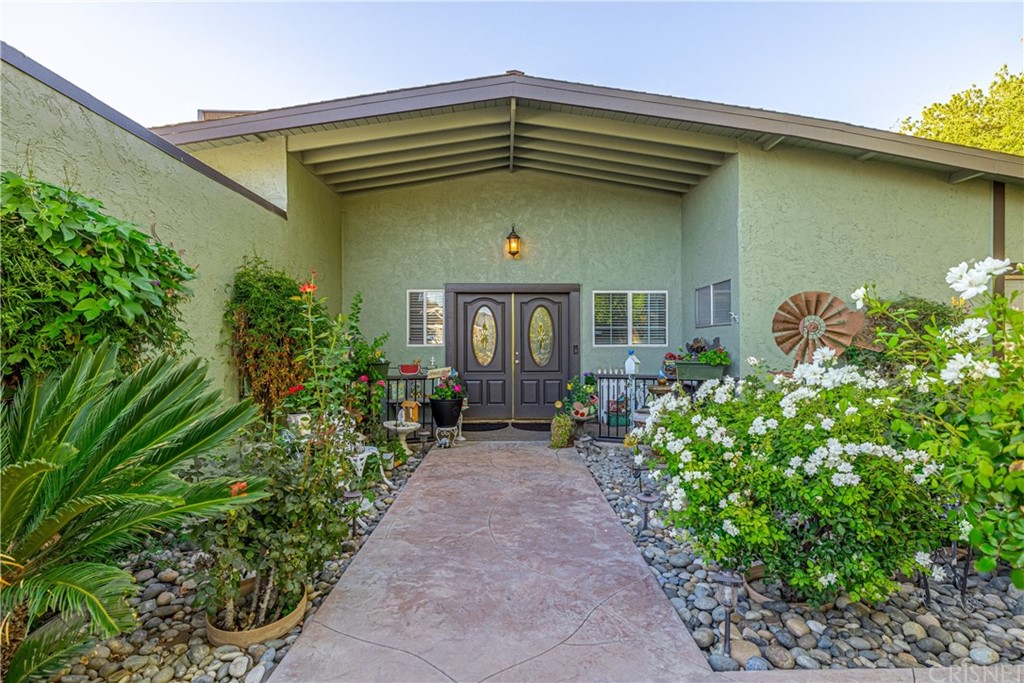 2701 West Ave J4 Lancaster, CA 93536 - Photo 6 of 46 a front view of a house with a yard