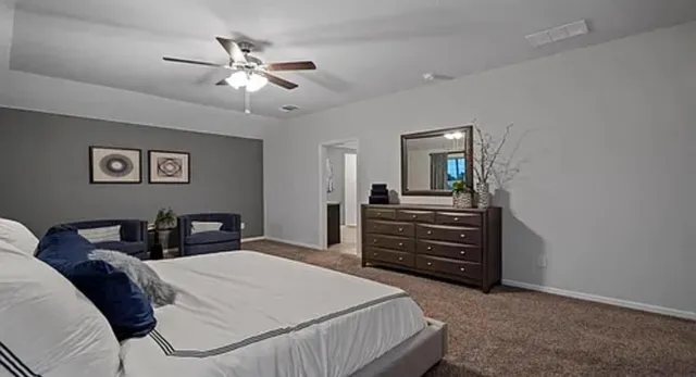 a view of a livingroom with furniture and a window