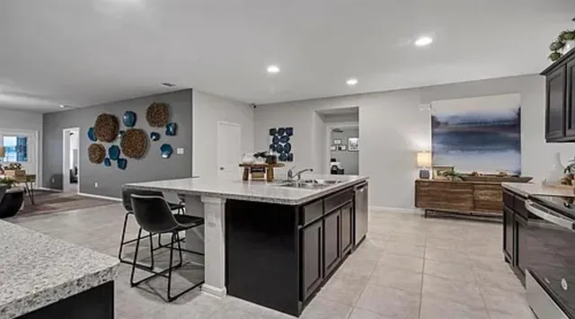 a front view of a house with a garden and yard