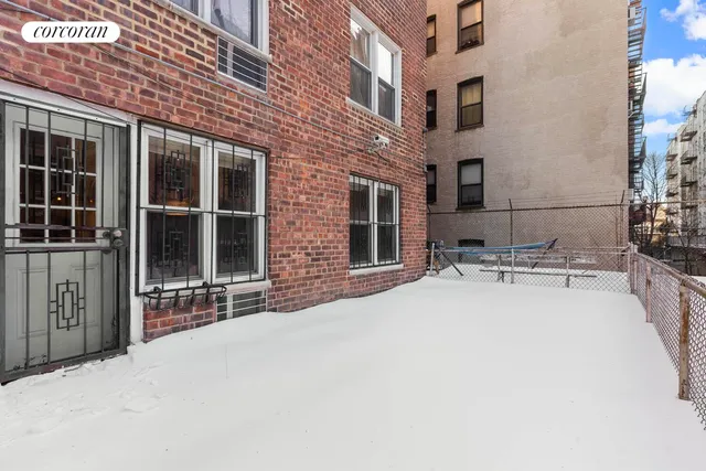 a building outdoor space with patio furniture and potted plants