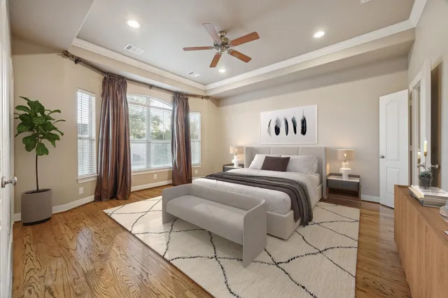 a view of a room with wooden floor and windows