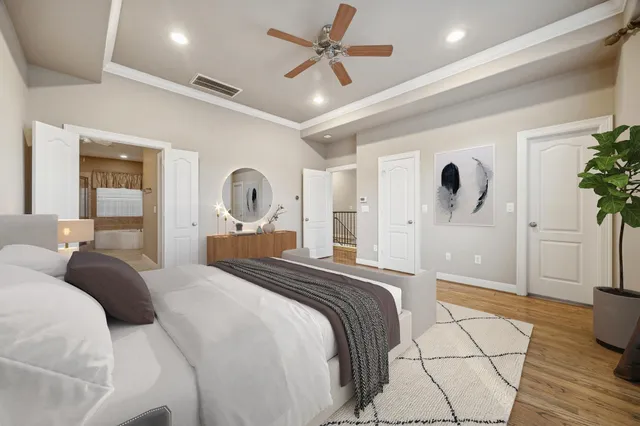 a bedroom with a large bed and a view living room