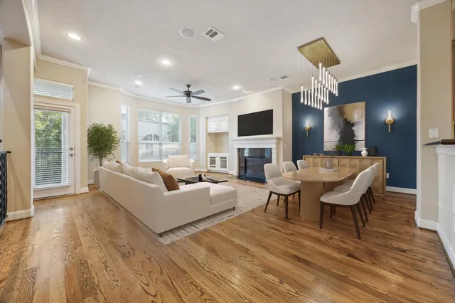a kitchen with counter space dining table and wooden floor