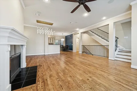 a view of entryway and hall with wooden floor