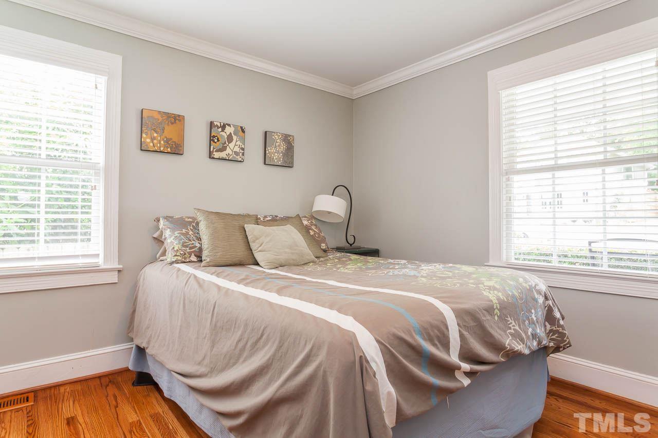 220 Georgetown Road Raleigh, NC 27608 - Photo 13 of 25 a bedroom with a bed and a window