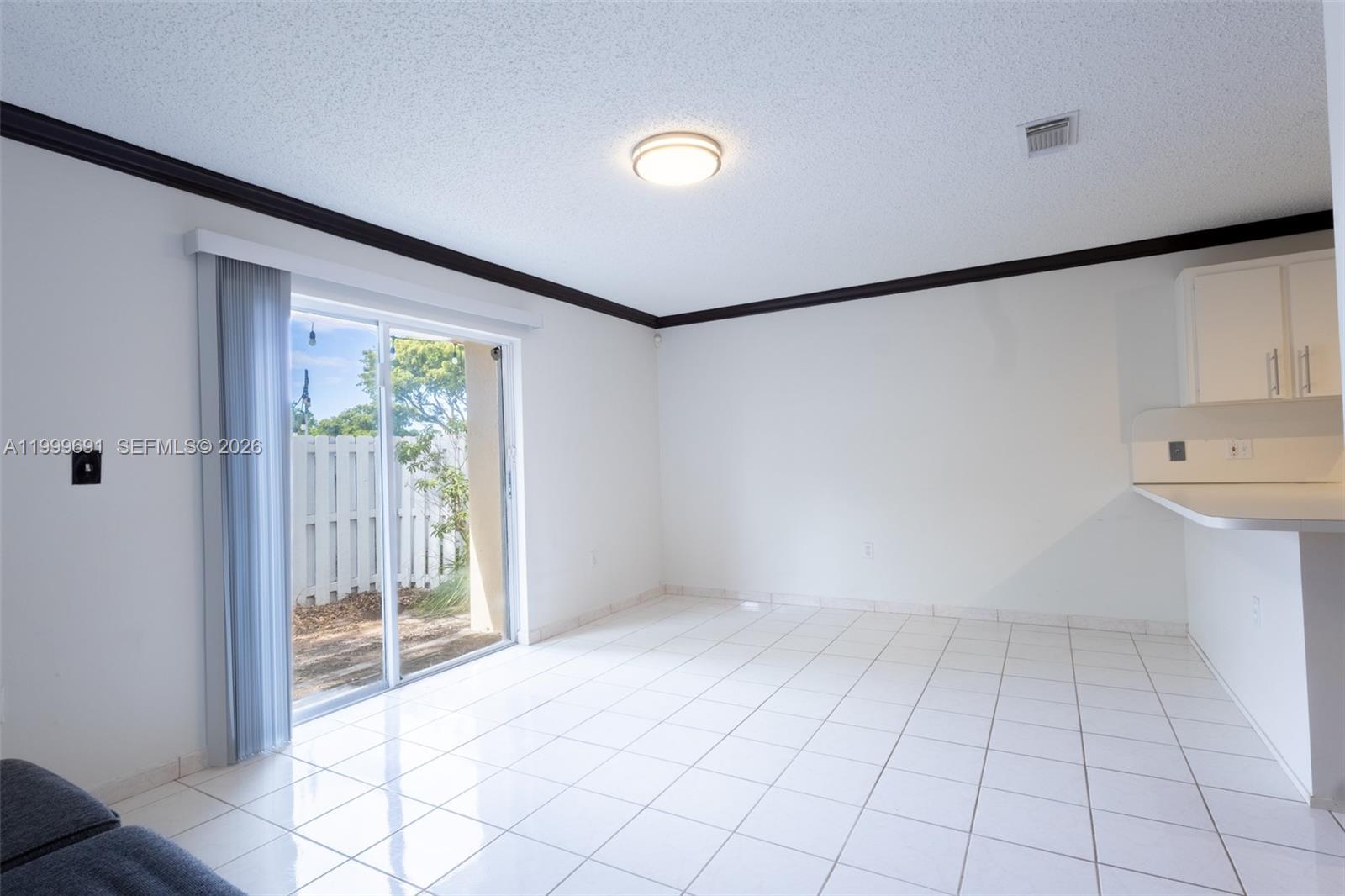 13874 Southwest 64th Street Miami, FL 33183 - Photo 15 of 25 a view of an empty room with a window