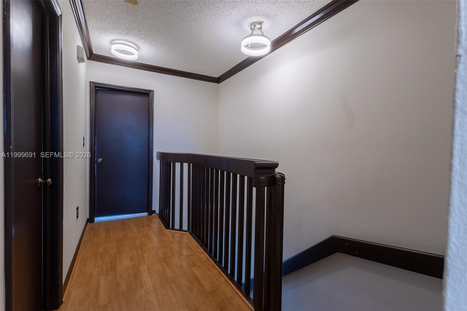 13874 Southwest 64th Street Miami, FL 33183 - Photo 18 of 25 a view of a hallway with wooden floor