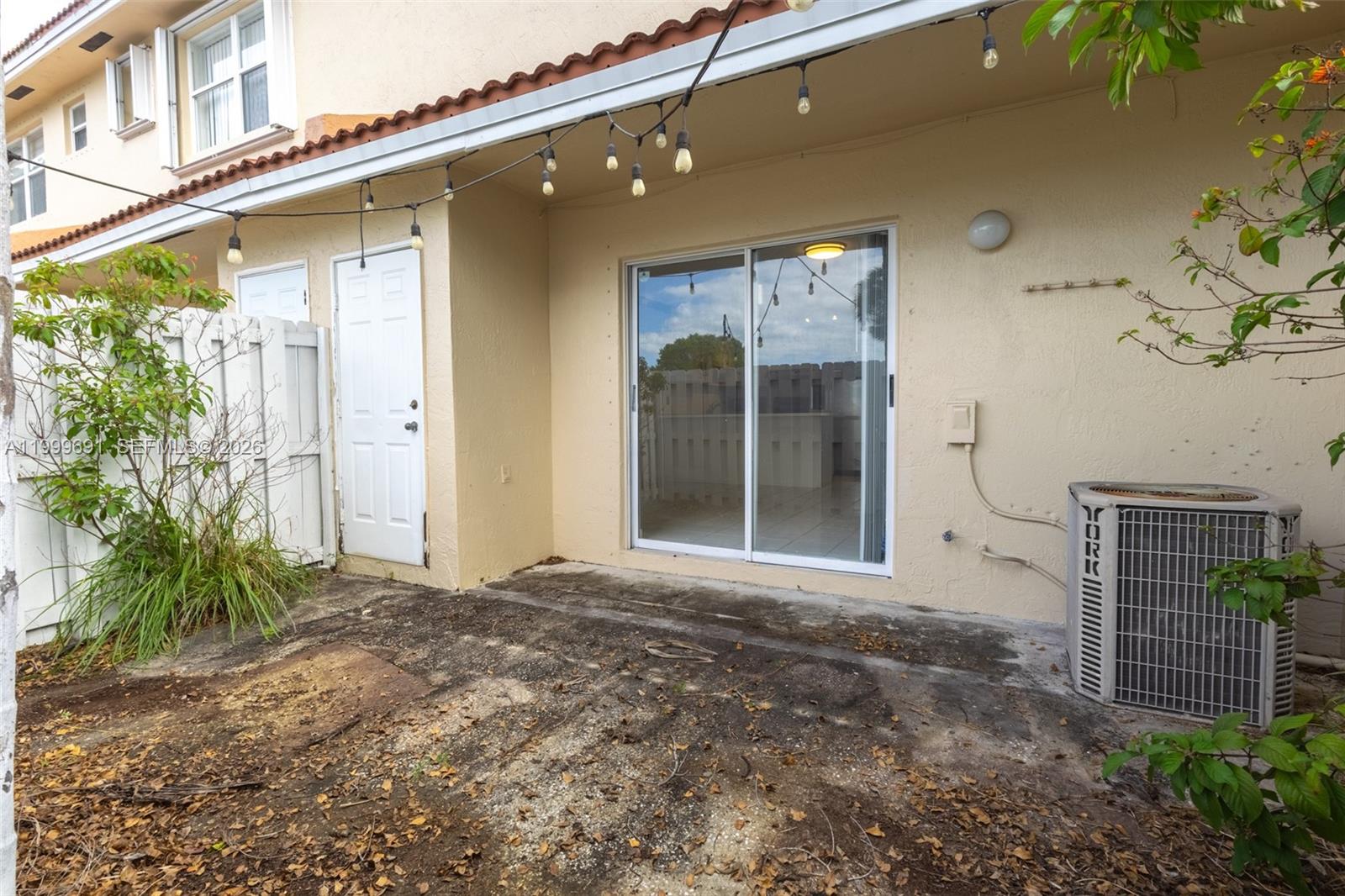 13874 Southwest 64th Street Miami, FL 33183 - Photo 24 of 25 a front view of a house with garden