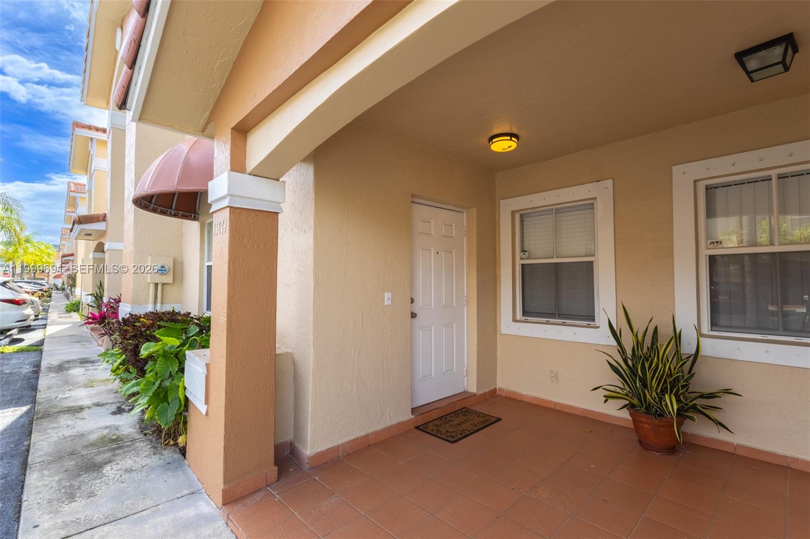 13874 Southwest 64th Street Miami, FL 33183 - Photo 3 of 25 a front view of a house having yard