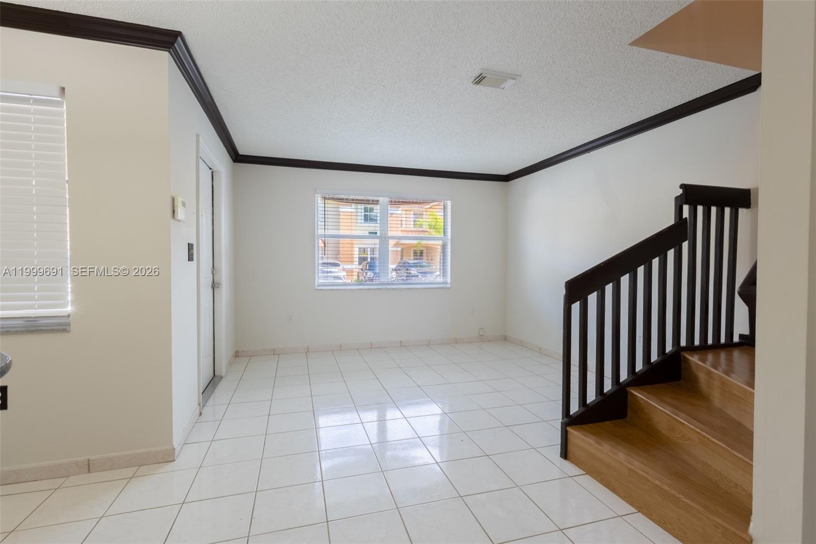 13874 Southwest 64th Street Miami, FL 33183 - Photo 4 of 25 a view of a hallway with entryway