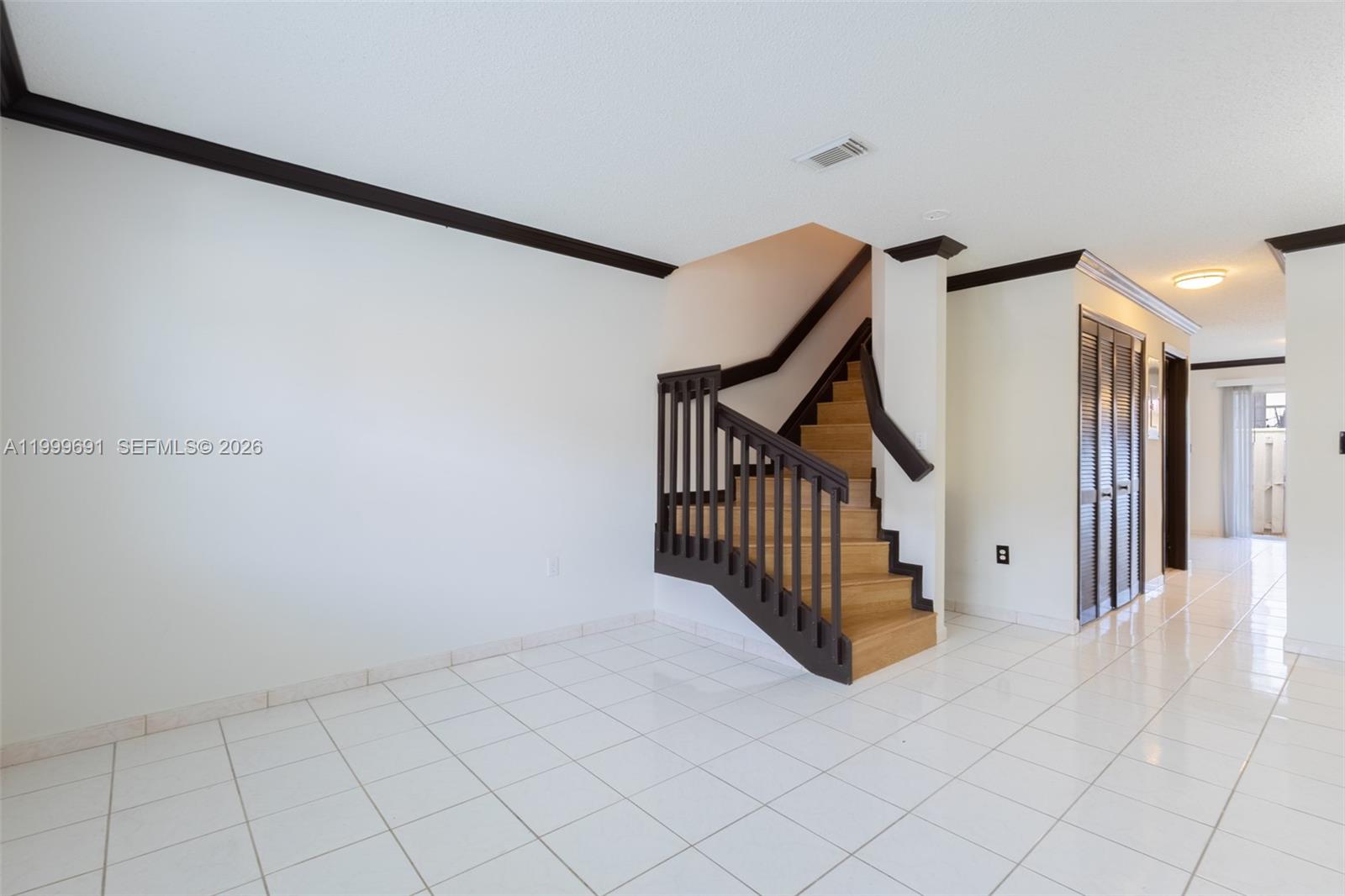 13874 Southwest 64th Street Miami, FL 33183 - Photo 5 of 25 a view of a hallway with staircase