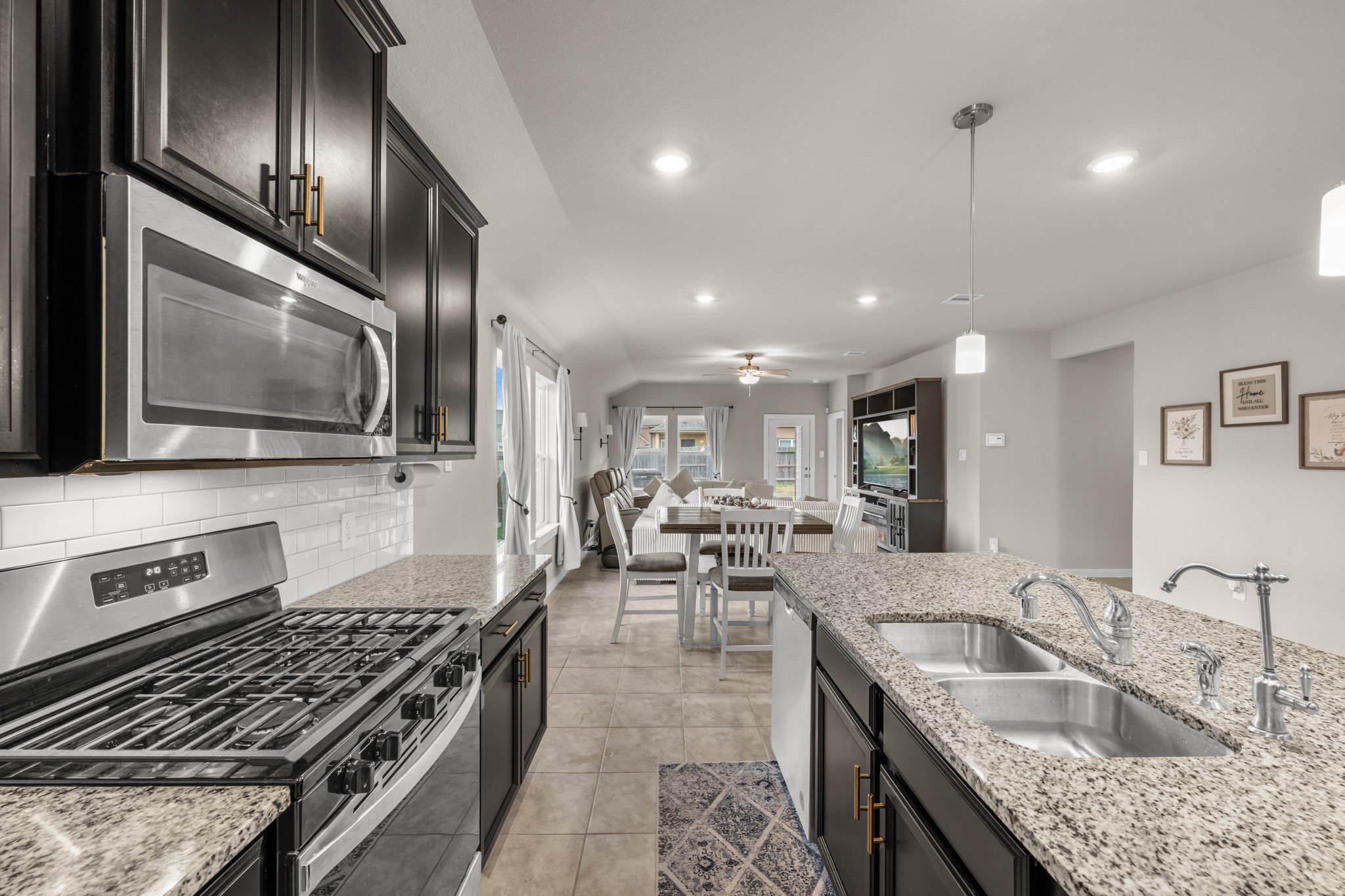 1326 Taft Pt Lane Rosharon, TX 77583 - Photo 11 of 39 a kitchen with stainless steel appliances granite countertop a sink stove and refrigerator