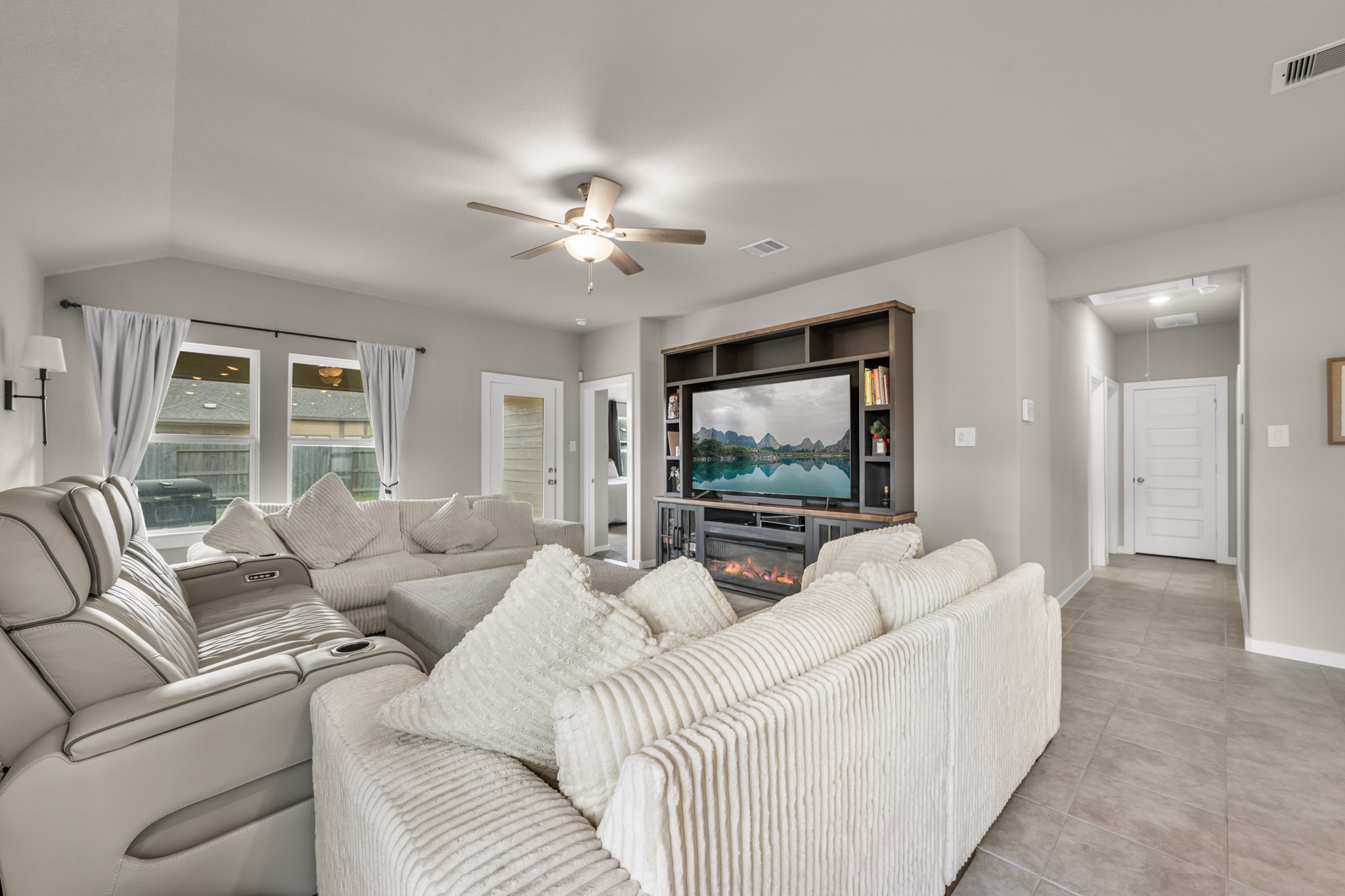 1326 Taft Pt Lane Rosharon, TX 77583 - Photo 17 of 39 a living room with furniture and a flat screen tv