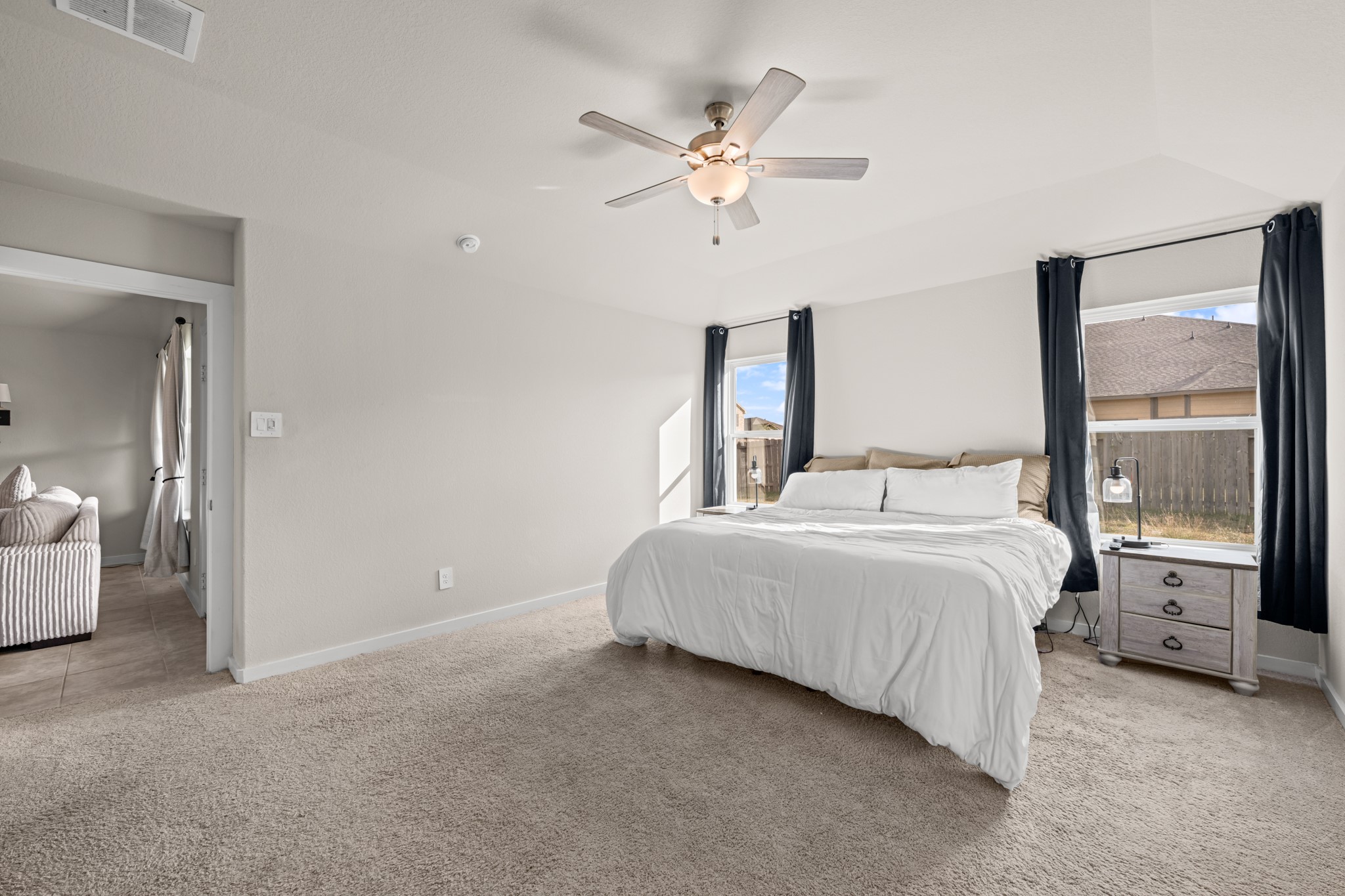 1326 Taft Pt Lane Rosharon, TX 77583 - Photo 21 of 39 a bedroom with a large bed and a chandelier
