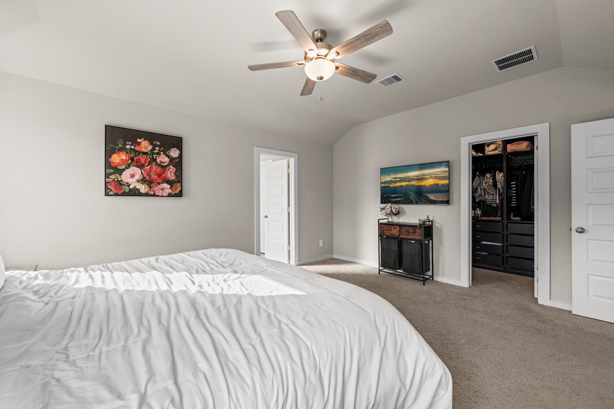 1326 Taft Pt Lane Rosharon, TX 77583 - Photo 22 of 39 a spacious bedroom with a bed and a chandelier