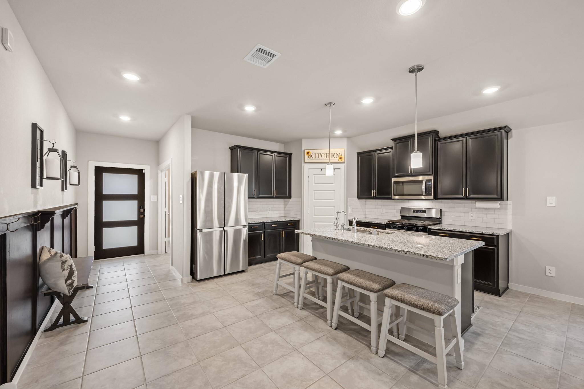 1326 Taft Pt Lane Rosharon, TX 77583 - Photo 6 of 39 a large kitchen with cabinets table and chairs