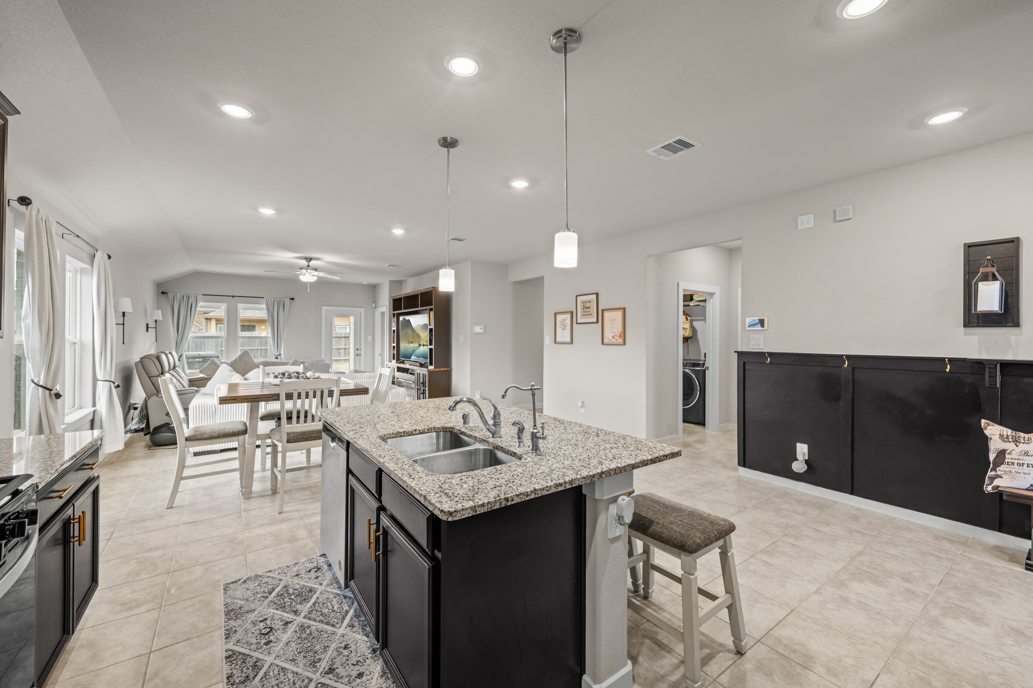 1326 Taft Pt Lane Rosharon, TX 77583 - Photo 8 of 39 a living room with kitchen island furniture a sink a counter top space and a center island