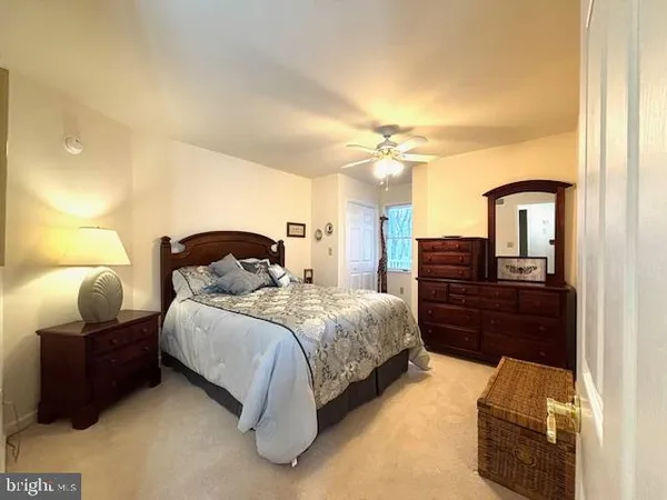 a bedroom with a bed and lamp