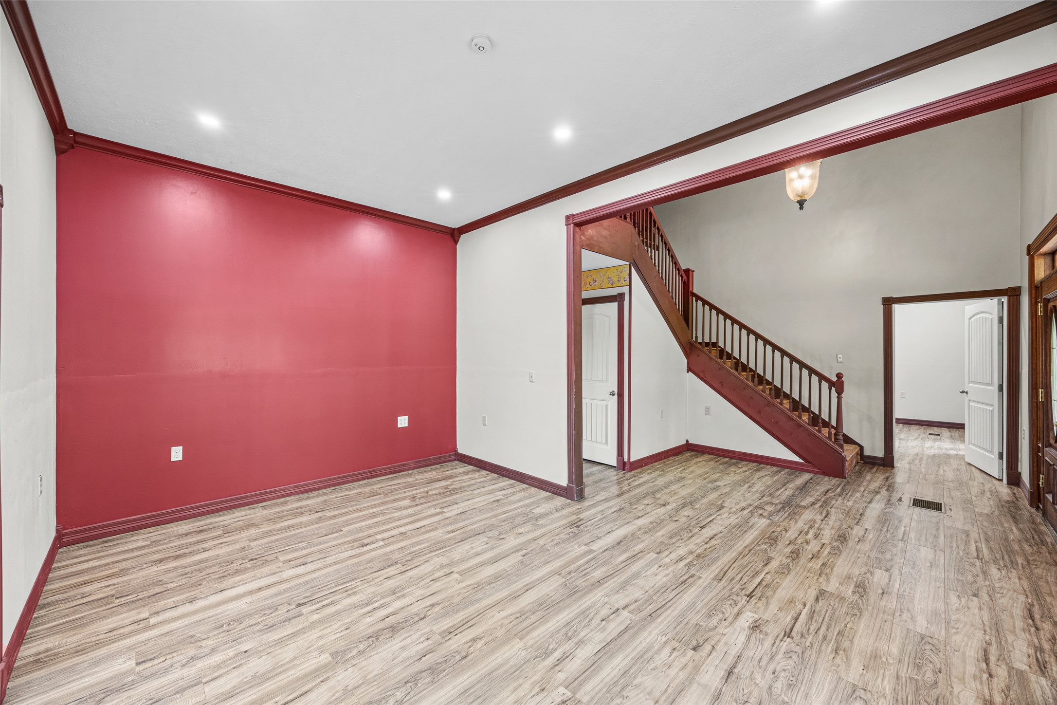 7 Northwood Country Road Huffman, TX 77336 - Photo 7 of 50 a view of an empty room with wooden floor and stairs