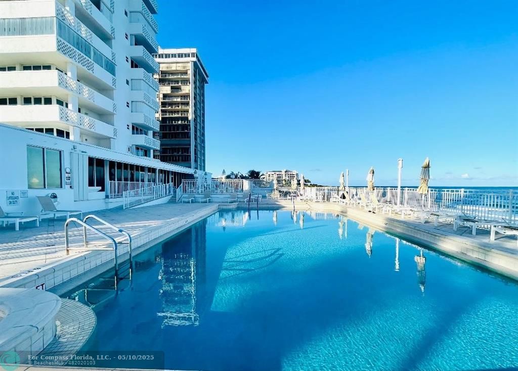 1200 South Ocean Boulevard, Unit 15D Boca Raton, FL 33432 - Photo 1 of 32 a view of a swimming pool with outdoor seating