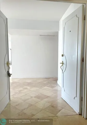 a view of wooden floor and entryway
