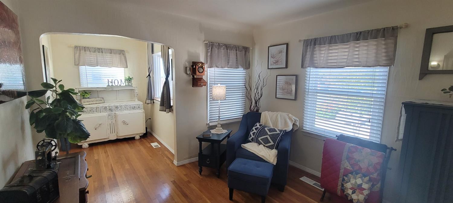 1410 10th Street Reedley, CA 93654 - Photo 14 of 44 a workspace with furniture and wooden floor