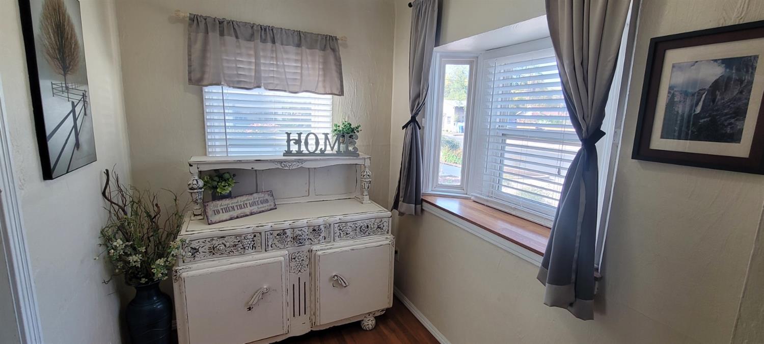 1410 10th Street Reedley, CA 93654 - Photo 16 of 44 a view of bathroom with a sink and mirror