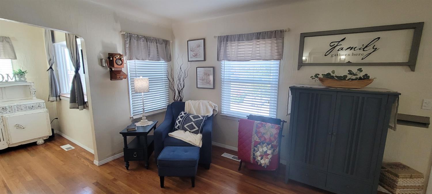 1410 10th Street Reedley, CA 93654 - Photo 19 of 44 a living room with furniture and a window