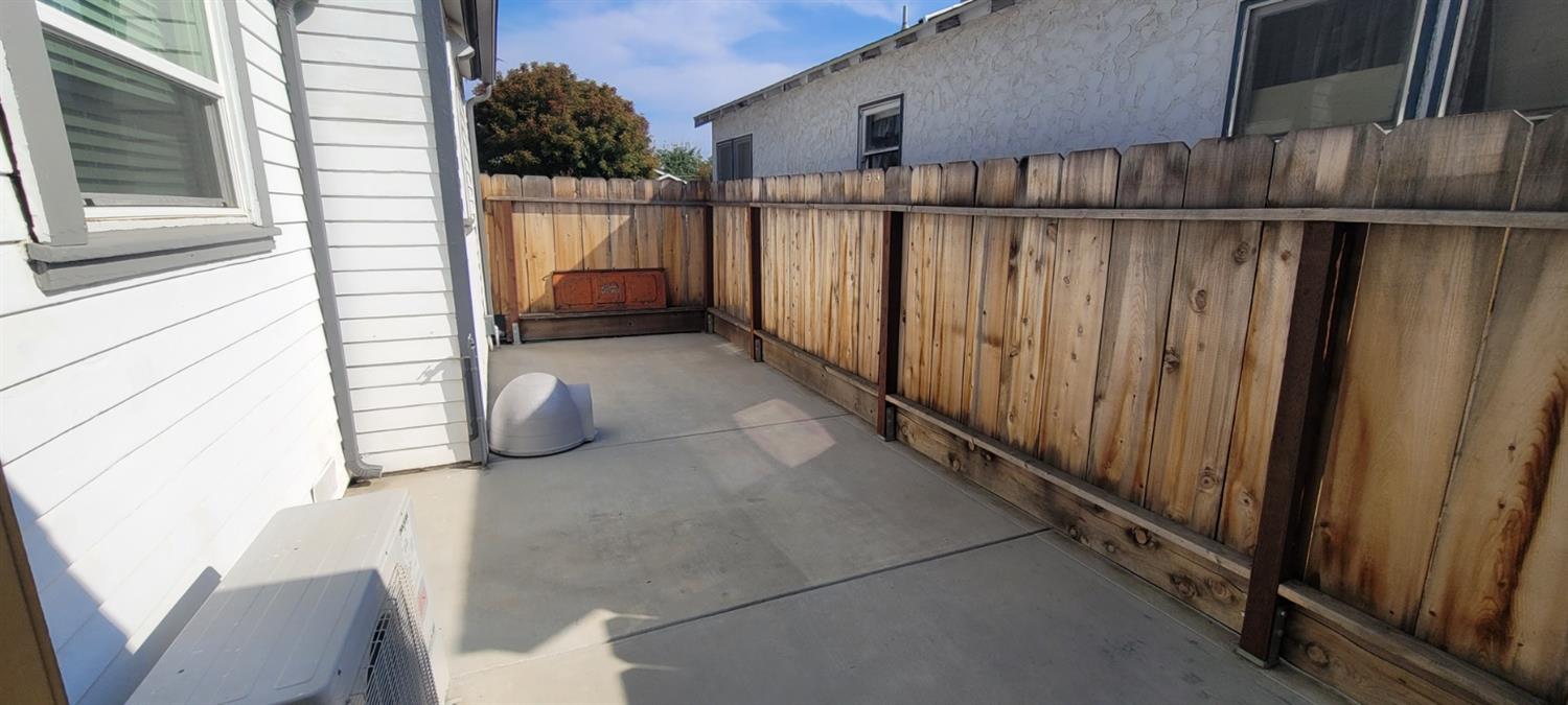 1410 10th Street Reedley, CA 93654 - Photo 27 of 44 a view of a wooden fence