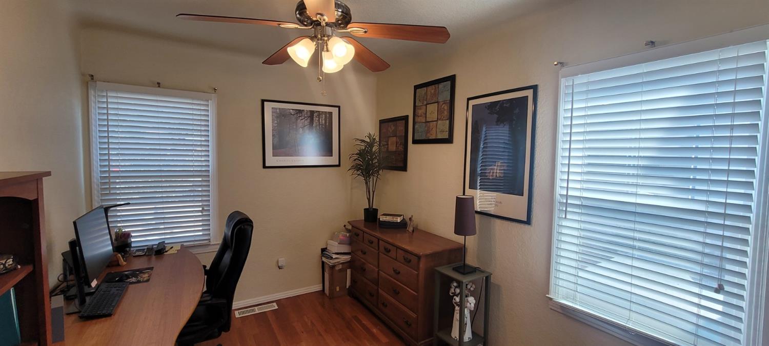 1410 10th Street Reedley, CA 93654 - Photo 30 of 44 a view of a workspace with furniture and a window