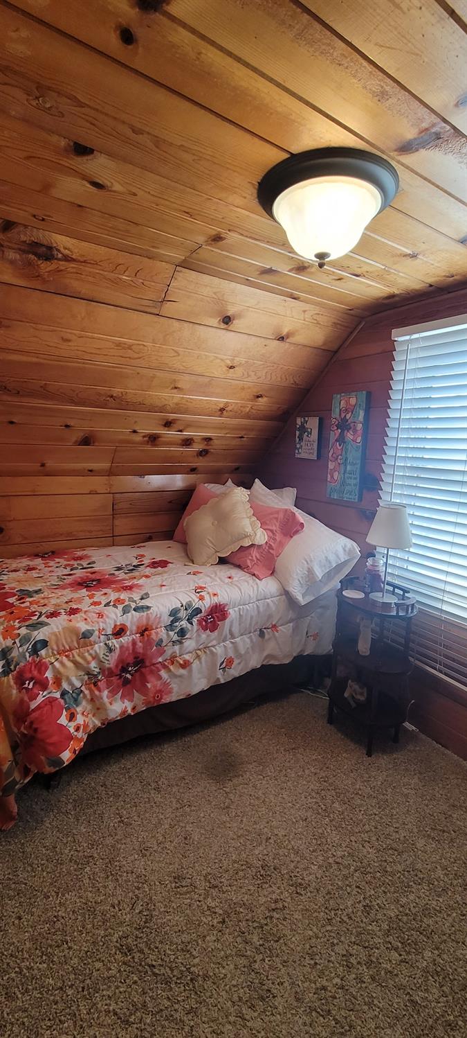 1410 10th Street Reedley, CA 93654 - Photo 31 of 44 a bedroom with a bed