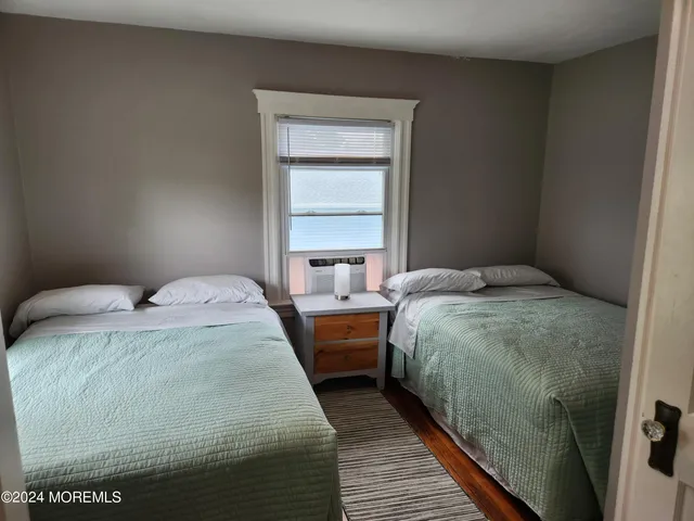 a bedroom with bed and window