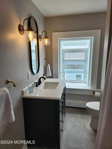 a bathroom with a sink and mirror