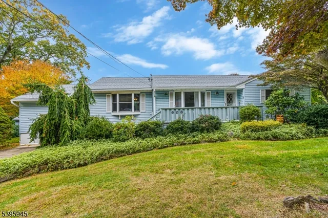 a view of house that has a yard