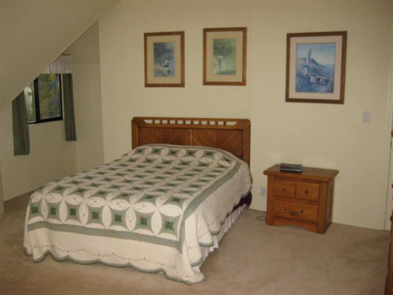 2363 Old Ferry Road Shady Cove, OR 97539 - Photo 15 of 31 a bedroom with a bed and painting on the wall