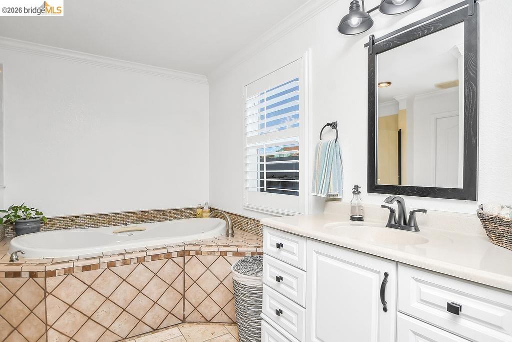 4190 Brown Road Oakley, CA 94561 - Photo 24 of 33 Full bath with vanity, ornamental molding, and a garden tub