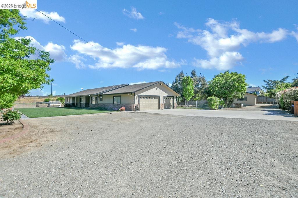 4190 Brown Road Oakley, CA 94561 - Photo 4 of 33 Single story home featuring concrete driveway, a garage, and stone siding
