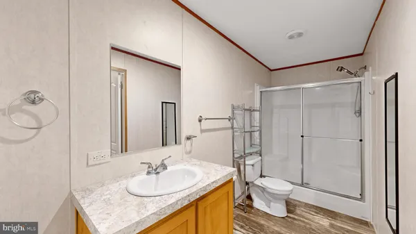 a view of a room with a flat screen tv