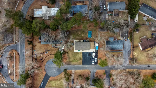 an aerial view of a residential apartment building with a yard