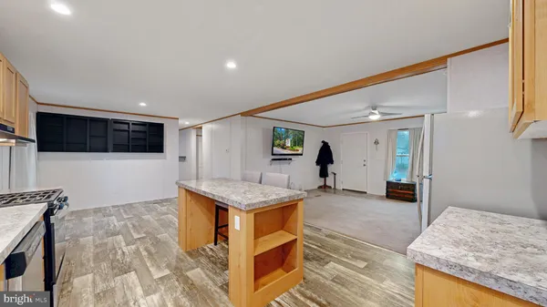 a view of a kitchen with a sink and cabinets