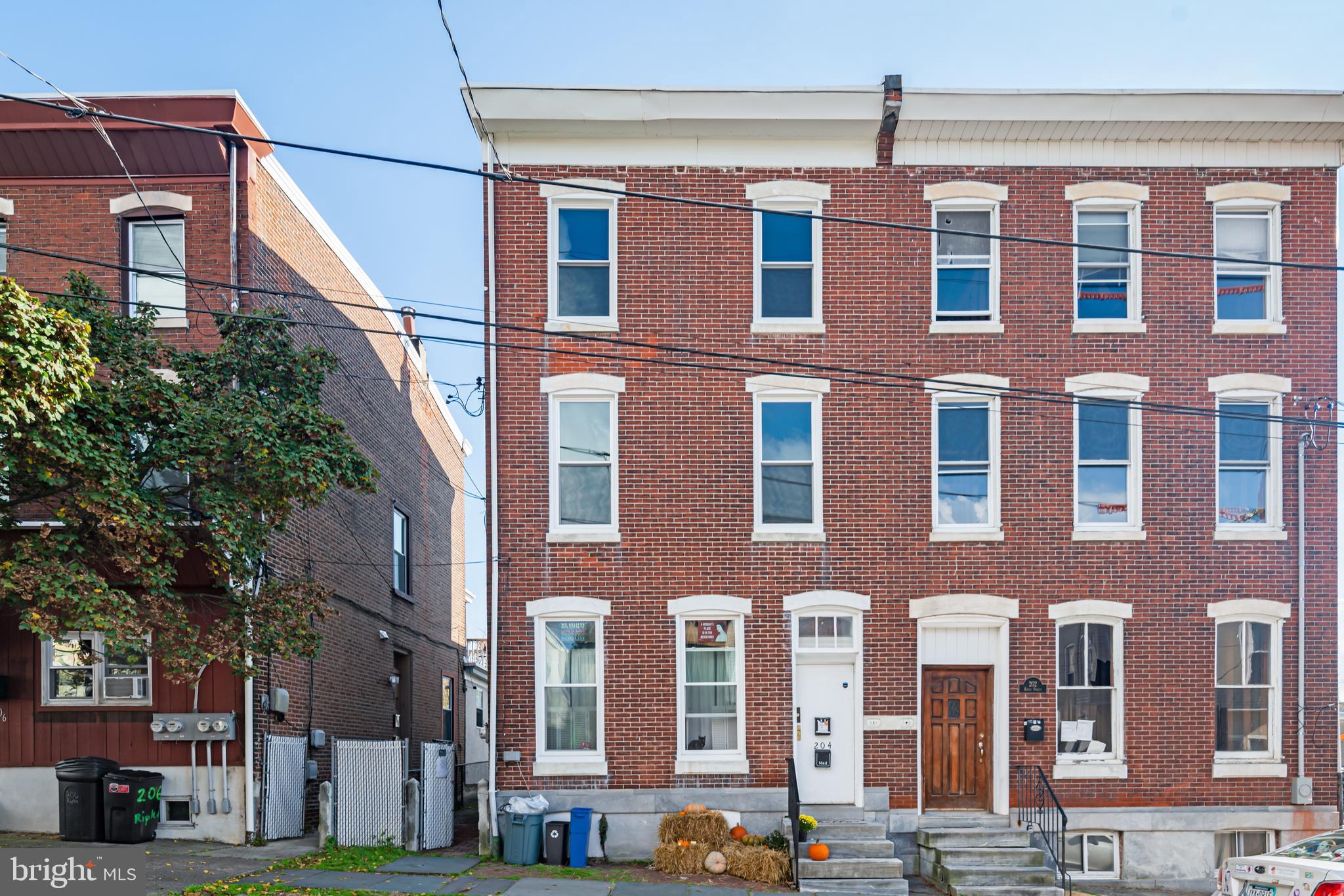 204 Ripka Street, Unit 2 Philadelphia, PA 19127 - Photo 1 of 22 a front view of a building with lot of cars