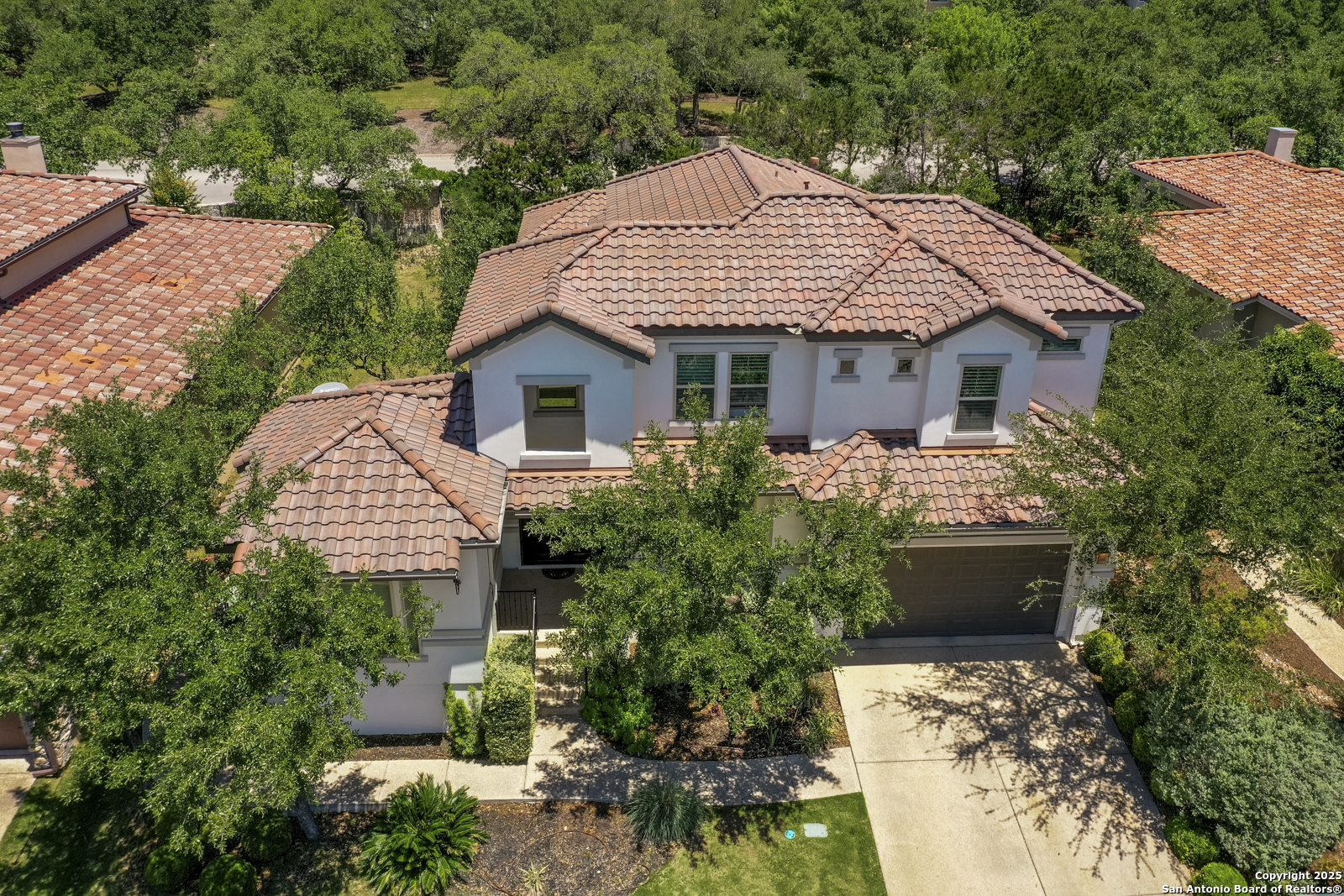 7106 Bluff Run San Antonio, TX 78257 - Photo 1 of 54 a front view of a house with a garden
