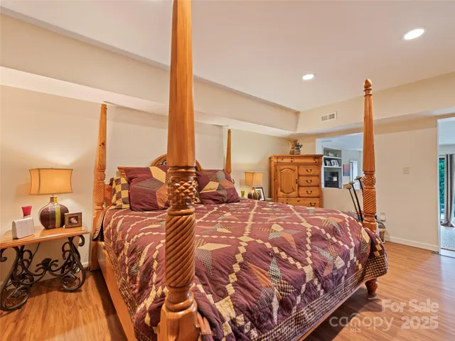 a bed room with two large bed and a large window