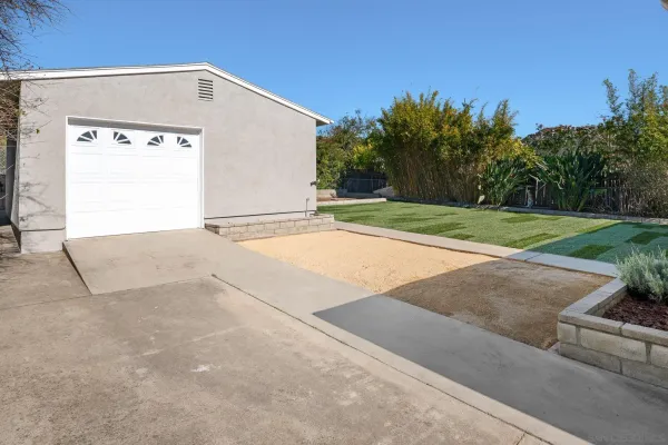 a view of backyard with large trees