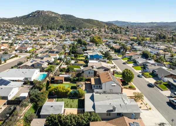 an aerial view of residential houses with outdoor space