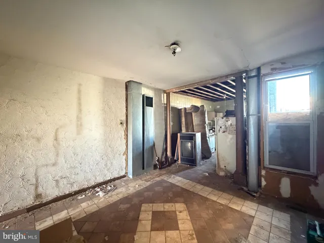 a kitchen with sink stove and cabinets
