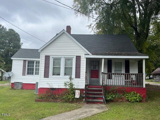 340 Cavel Chub Lake Road Roxboro, NC 27574 - Photo 1 of 12 front view of a house with a yard
