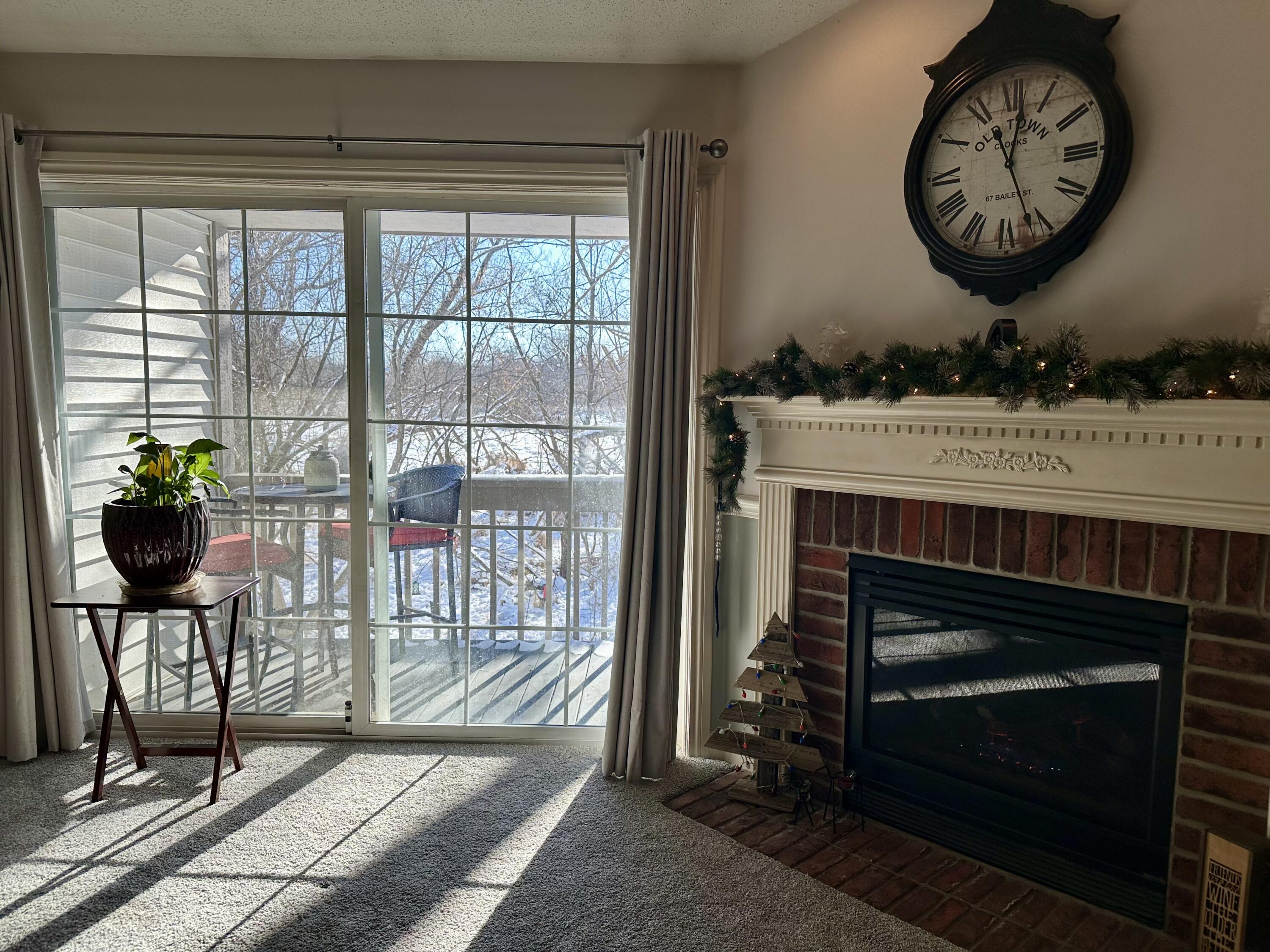 636 Pewaukee Road, Unit H Pewaukee, WI 53072 - Photo 4 of 43 Sunlit Living Room
